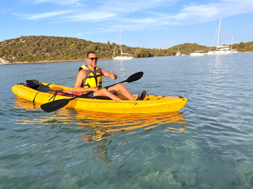 Guide giving a thumbs up on a sunny paddle